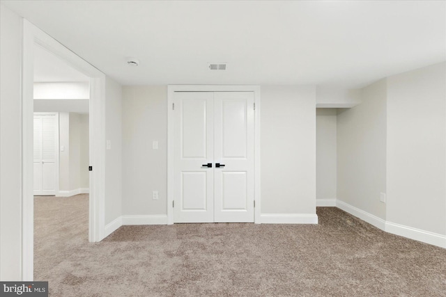 2424 W Lanvale St, Baltimore, MD 21216 - below grade area featuring carpet flooring and baseboards