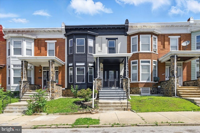 2424 W Lanvale St, Baltimore, MD 21216 - townhome / multi-family property featuring brick siding and central air condition unit