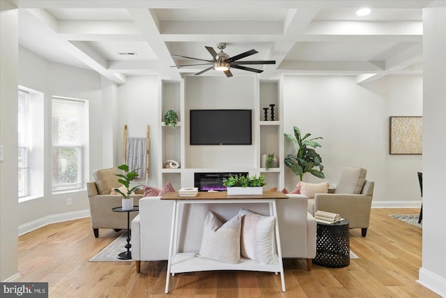 2424 W Lanvale St, Baltimore, MD 21216 - living area with wood finished floors, a glass covered fireplace, a ceiling fan, baseboards, and beamed ceiling