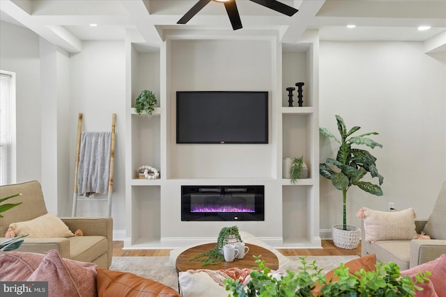 2424 W Lanvale St, Baltimore, MD 21216 - living area featuring wood finished floors, ceiling fan, built in shelves, a glass covered fireplace, and recessed lighting