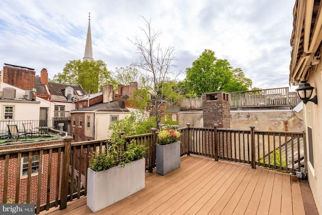 wooden terrace featuring a residential view