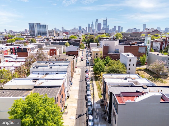 drone / aerial view featuring a city view