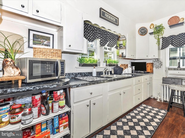 1606 N Market St, Frederick, MD 21701 - kitchen featuring stainless steel microwave, white cabinets, and dark countertops