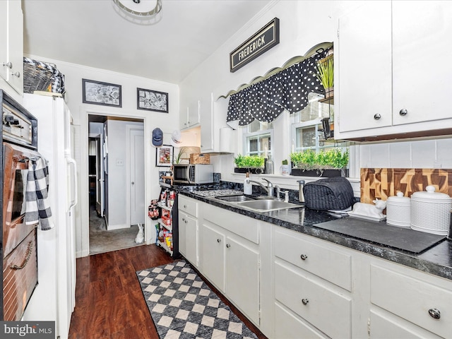 1606 N Market St, Frederick, MD 21701 - kitchen with a sink, white cabinetry, and dark wood-type flooring