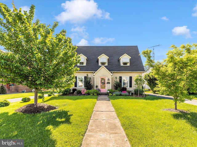 1606 N Market St, Frederick, MD 21701 - new england style home featuring a front lawn, brick siding, and roof with shingles