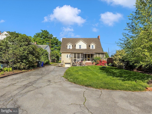 1606 N Market St, Frederick, MD 21701 - new england style home with a sunroom, driveway, and a chimney