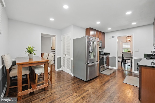 6404 Yates Ford Rd, Manassas, VA 20111 - kitchen with appliances with stainless steel finishes, dark wood finished floors, recessed lighting, a sink, and baseboards