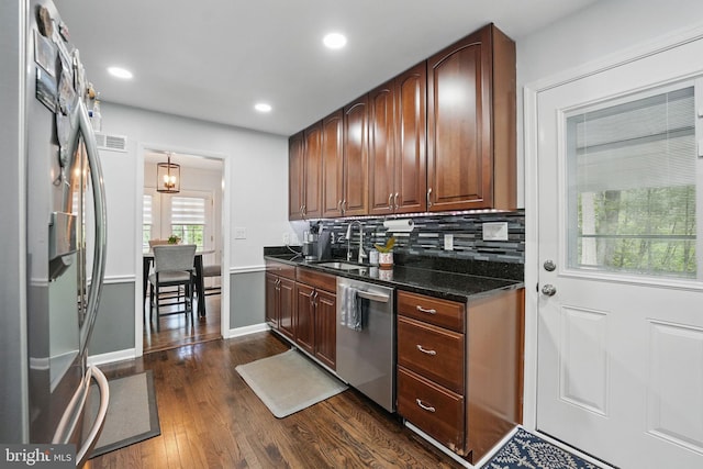 6404 Yates Ford Rd, Manassas, VA 20111 - kitchen featuring appliances with stainless steel finishes, a sink, dark wood-style floors, backsplash, and recessed lighting
