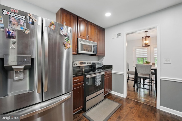 6404 Yates Ford Rd, Manassas, VA 20111 - kitchen with appliances with stainless steel finishes, dark wood-style floors, dark countertops, recessed lighting, and baseboards
