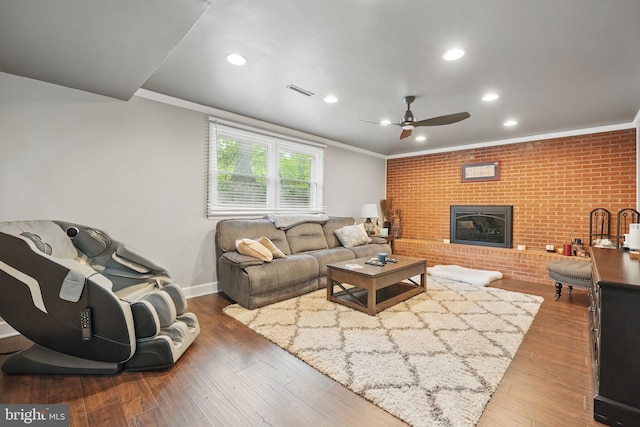 6404 Yates Ford Rd, Manassas, VA 20111 - living area with crown molding, a ceiling fan, wood finished floors, a fireplace, and recessed lighting