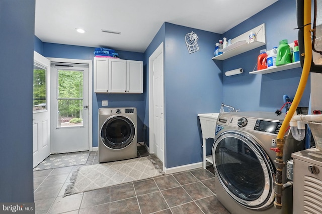 6404 Yates Ford Rd, Manassas, VA 20111 - laundry room featuring washer and clothes dryer, cabinet space, dark tile patterned floors, baseboards, and recessed lighting