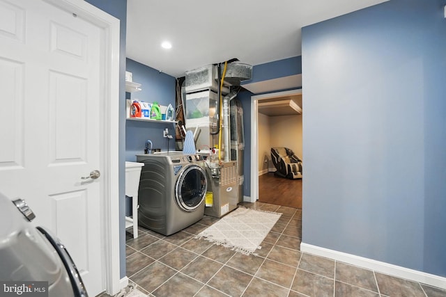 6404 Yates Ford Rd, Manassas, VA 20111 - laundry area with washer / dryer, heating unit, baseboards, and tile patterned floors