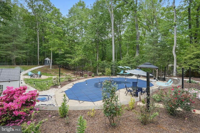 6404 Yates Ford Rd, Manassas, VA 20111 - view of pool with a gazebo, a storage shed, a patio, a covered pool, and an outdoor structure