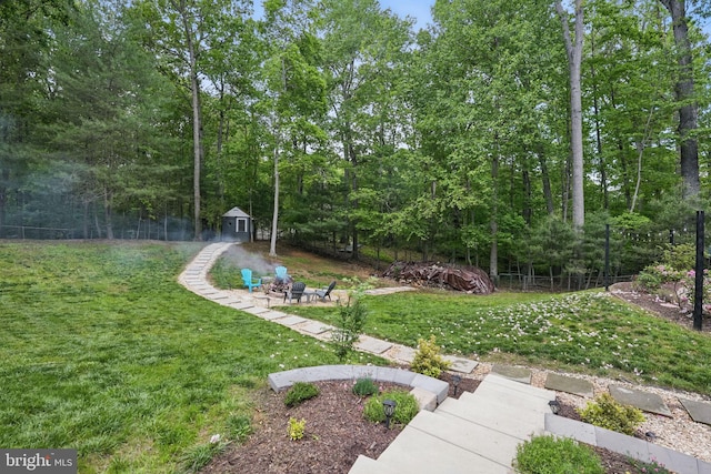 6404 Yates Ford Rd, Manassas, VA 20111 - view of yard with a storage unit and an outbuilding