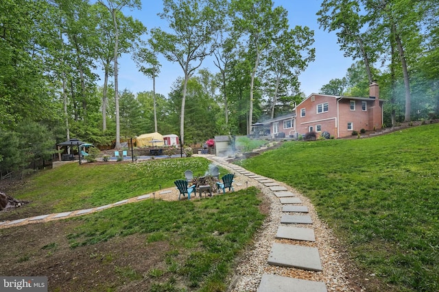 6404 Yates Ford Rd, Manassas, VA 20111 - view of green lawn with an outdoor fire pit and view of scattered trees