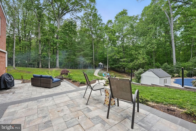 6404 Yates Ford Rd, Manassas, VA 20111 - view of patio / terrace with a shed, an outdoor structure, outdoor dining space, and an outdoor living space