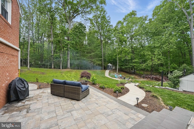 6404 Yates Ford Rd, Manassas, VA 20111 - view of patio featuring grilling area, an outdoor structure, and a storage shed
