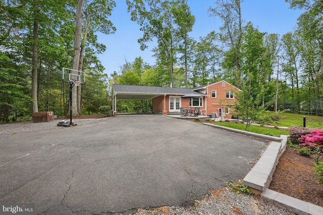 6404 Yates Ford Rd, Manassas, VA 20111 - split level home featuring french doors, asphalt driveway, brick siding, and a carport
