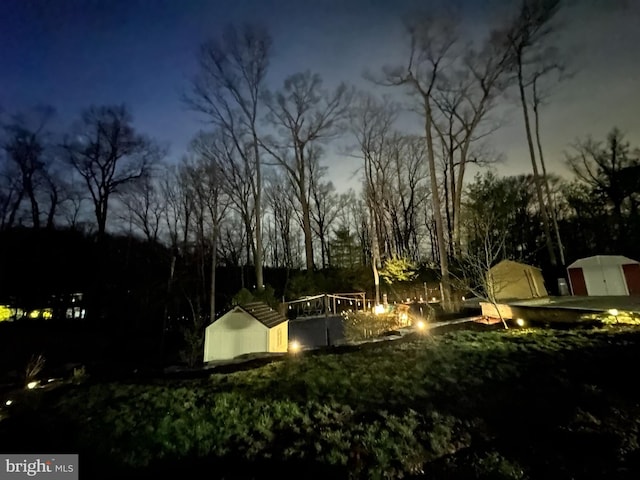 6404 Yates Ford Rd, Manassas, VA 20111 - view of community with a shed, an outbuilding, and a fire pit