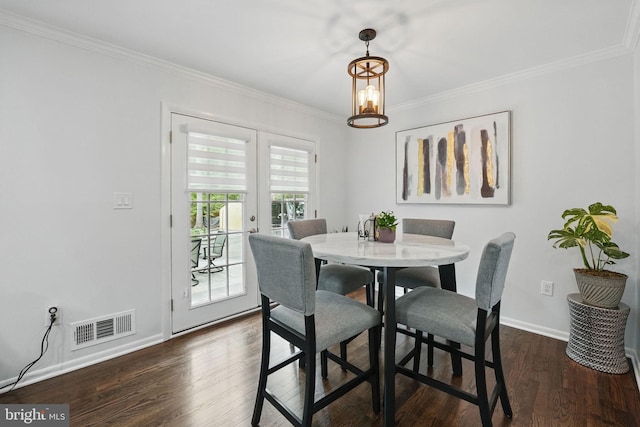 6404 Yates Ford Rd, Manassas, VA 20111 - dining space featuring ornamental molding, dark wood finished floors, baseboards, and a chandelier