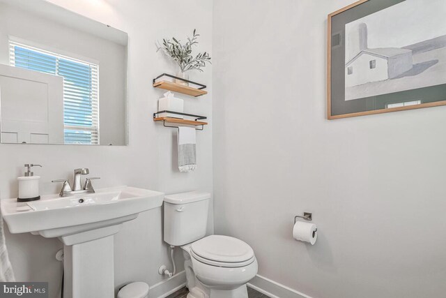 14540 Grace Kellen Ave, Brandywine, MD 20613 - bathroom with baseboards, toilet, and a sink