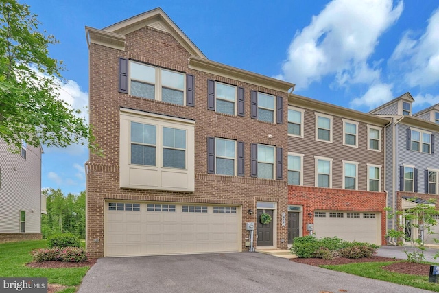 14540 Grace Kellen Ave, Brandywine, MD 20613 - townhome / multi-family property with an attached garage, brick siding, and asphalt driveway