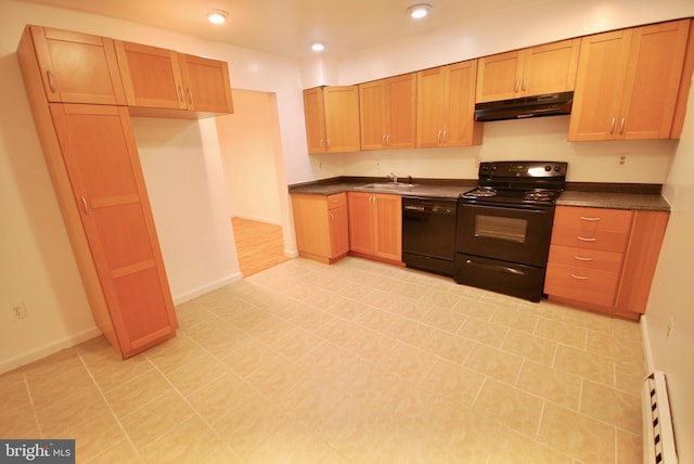 kitchen with baseboard heating, under cabinet range hood, a sink, black appliances, and dark countertops