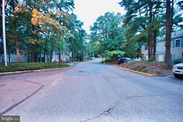 view of road featuring curbs and a residential view