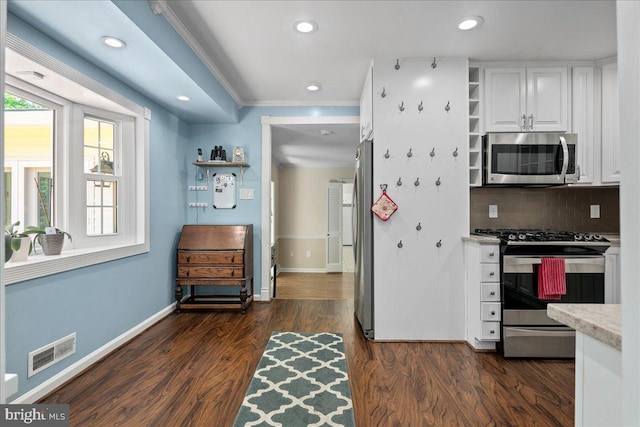8513 Bound Brook Ln, Alexandria, VA 22309 - kitchen with appliances with stainless steel finishes, white cabinetry, open shelves, baseboards, and decorative backsplash