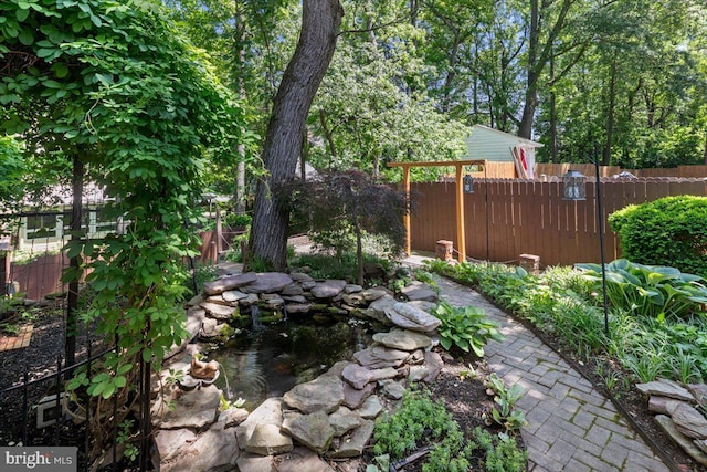 8513 Bound Brook Ln, Alexandria, VA 22309 - view of yard with fence and a small pond