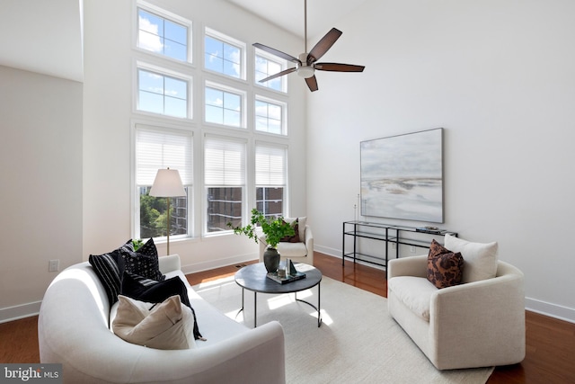 1418 N Rhodes St Unit B401, Arlington, VA 22209 - living room with a towering ceiling, a ceiling fan, baseboards, and wood finished floors