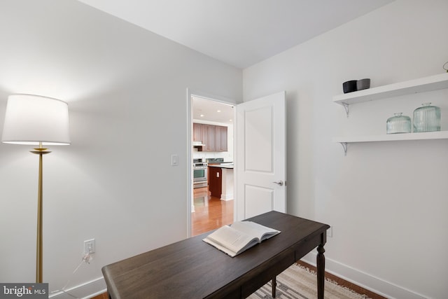 1418 N Rhodes St Unit B401, Arlington, VA 22209 - home office featuring baseboards and light wood-style floors