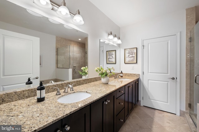 1418 N Rhodes St Unit B401, Arlington, VA 22209 - bathroom featuring double vanity, a shower stall, and tile patterned flooring