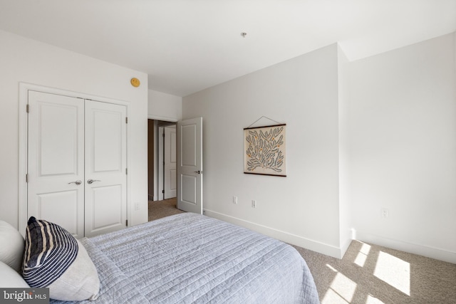 1418 N Rhodes St Unit B401, Arlington, VA 22209 - carpeted bedroom featuring a closet and baseboards