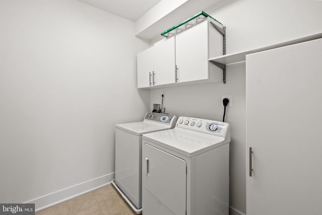 1418 N Rhodes St Unit B401, Arlington, VA 22209 - laundry room with independent washer and dryer, cabinet space, and baseboards