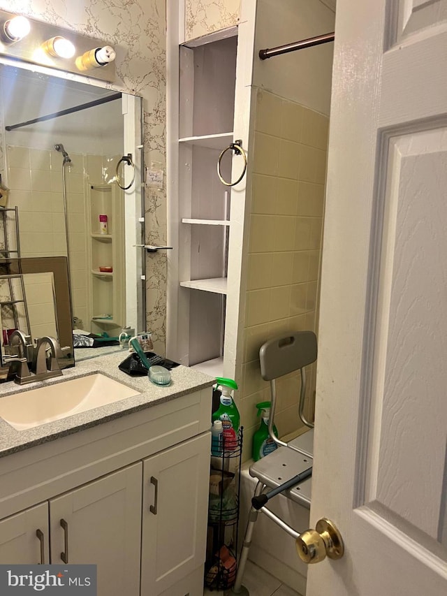 4136 Cambridge St, Philadelphia, PA 19104 - bathroom with a shower, vanity, and wallpapered walls