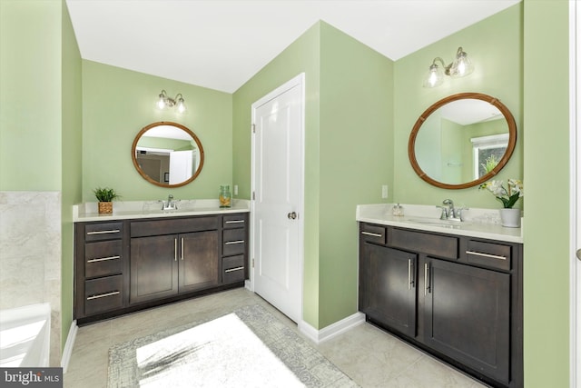 5609 Zoe Ln, Frederick, MD 21704 - full bath with tile patterned flooring, two vanities, and a sink
