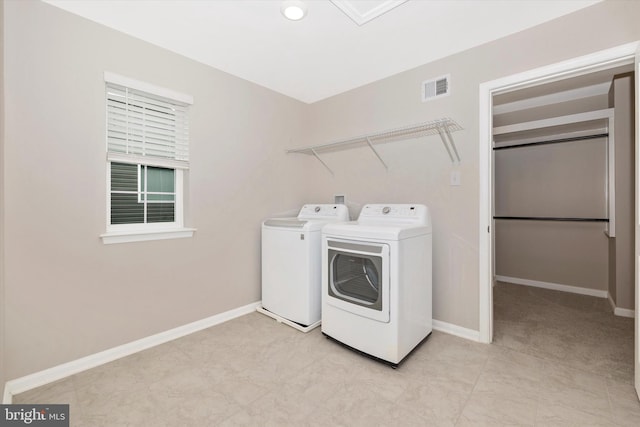 5609 Zoe Ln, Frederick, MD 21704 - washroom with laundry area, washer and clothes dryer, visible vents, and baseboards