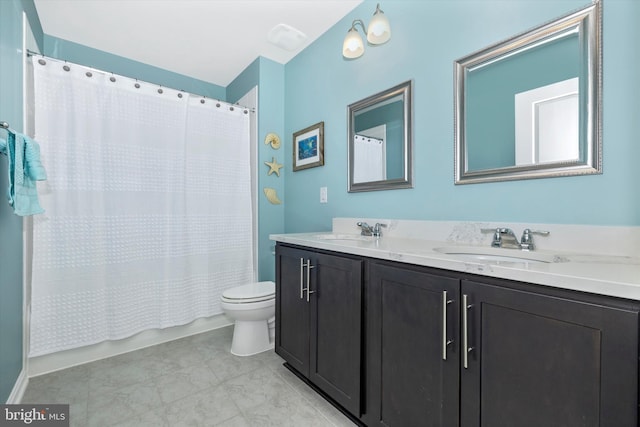5609 Zoe Ln, Frederick, MD 21704 - full bathroom featuring double vanity, toilet, shower / tub combo with curtain, and a sink