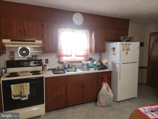 2153 Turnpike Rd, Elizabethtown, PA 17022 - kitchen with electric range oven, freestanding refrigerator, under cabinet range hood, light countertops, and light marble finish flooring