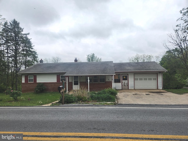 2153 Turnpike Rd, Elizabethtown, PA 17022 - single story home with brick siding, an attached garage, and concrete driveway
