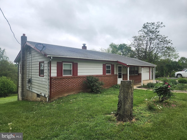 2153 Turnpike Rd, Elizabethtown, PA 17022 - ranch-style home featuring a chimney, an attached garage, a front yard, and brick siding