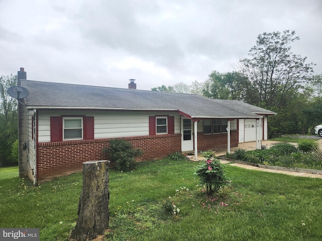 2153 Turnpike Rd, Elizabethtown, PA 17022 - ranch-style house with brick siding, an attached garage, a front lawn, and a chimney