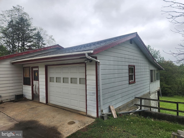 2153 Turnpike Rd, Elizabethtown, PA 17022 - view of side of property with a garage, driveway, a shingled roof, and fence