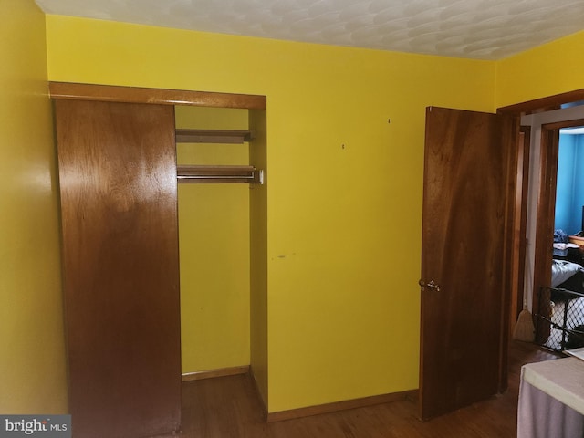 2153 Turnpike Rd, Elizabethtown, PA 17022 - unfurnished bedroom featuring a closet, wood finished floors, and baseboards