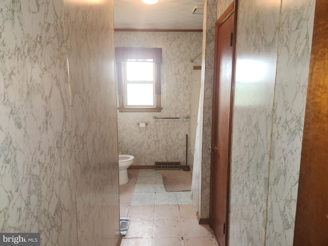2153 Turnpike Rd, Elizabethtown, PA 17022 - bathroom with toilet and crown molding