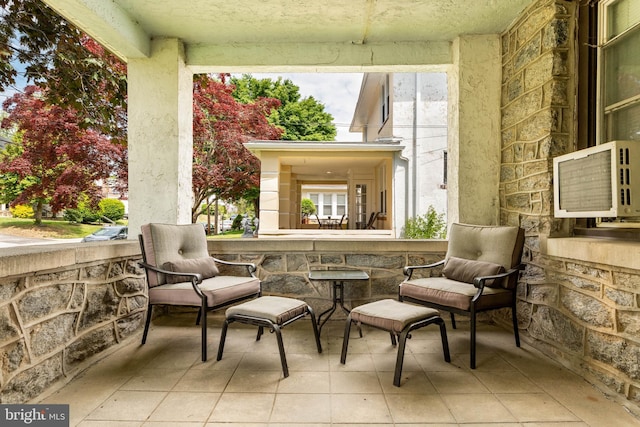 sitting room featuring tile patterned floors and plenty of natural light