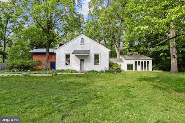1420 Little Conestoga Rd, Glenmoore, PA 19343 - view of front of property with a front lawn, a chimney, an outdoor structure, a standing seam roof, and metal roof