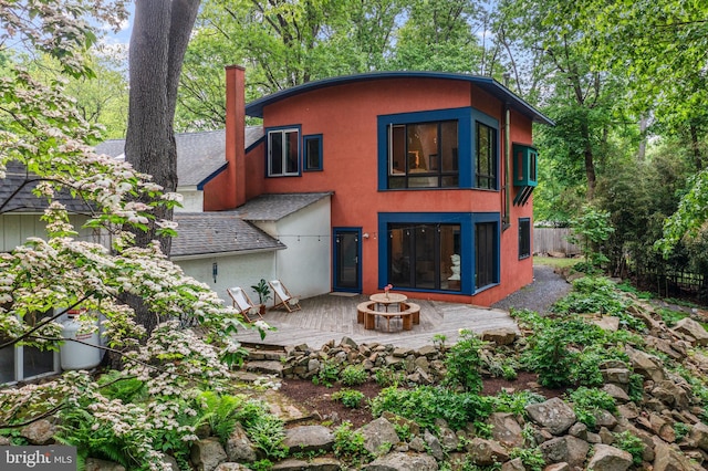 1420 Little Conestoga Rd, Glenmoore, PA 19343 - rear view of house featuring a patio area, stucco siding, a fire pit, and fence