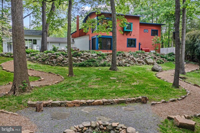 1420 Little Conestoga Rd, Glenmoore, PA 19343 - rear view of property featuring stucco siding and a yard
